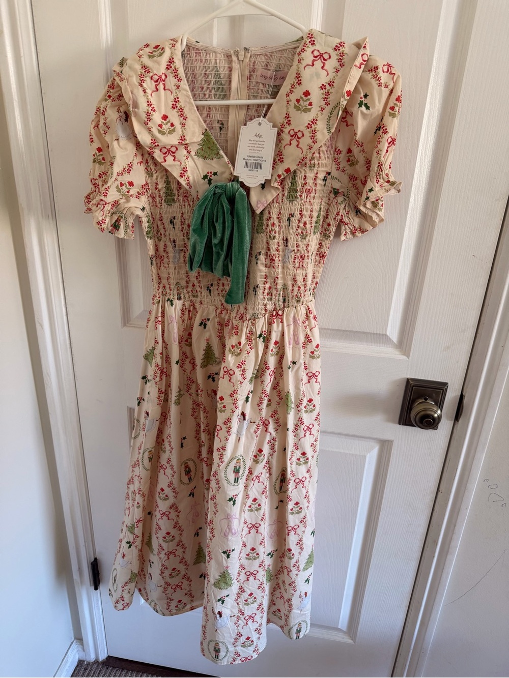 Ivy city co Yuletide Cream Smocked Midi Dress with Green Tie and Holiday Print